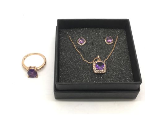 A 9ct gold jewellery set with amethyst comprising necklace, a ring and a pair of earrings.