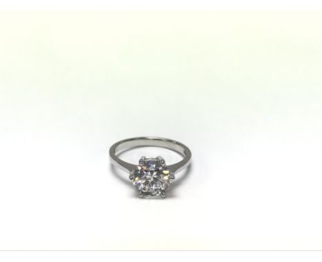 A pretty 14ct white gold ring set with a cubic zirconia. Measuring approximately ring size M - NO RESERVE