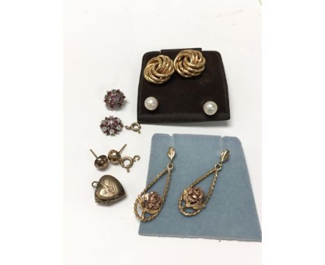 Two pairs of 9ct gold earrings, Pearl earrings, a pair of ruby and diamond earrings (one a/f), and some others.
