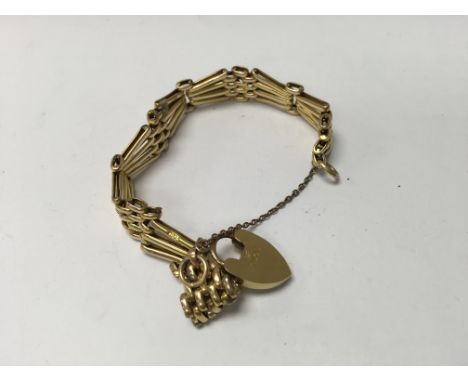 A 18 ct gold gate bracelet with heart attached clasp 28 grams.