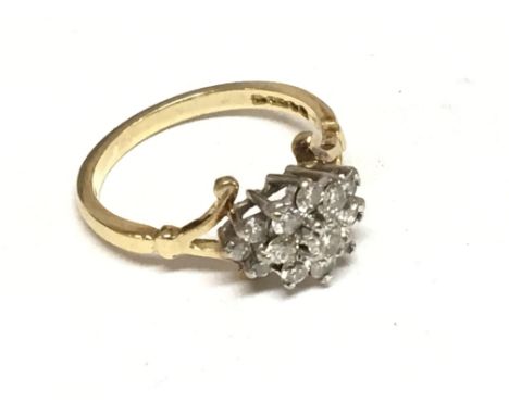 An 18carat gold ring with a shaped shank set with a cluster of brilliant cut diamonds. Ring size M. Weight 3.4g