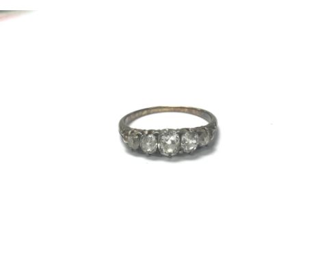 A 5 stone old cut diamond ring. The approximate ring size is N.