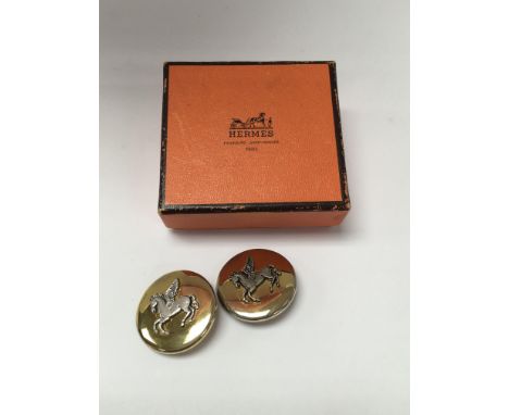A pair of Hermes clip on earrings.