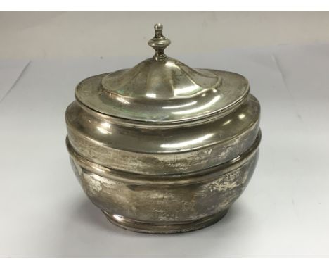 A silver tea caddy, London hallmarks.