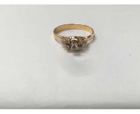 An unmarked gold ring set with a pattern of diamonds. The approximate ring size is between M and N.