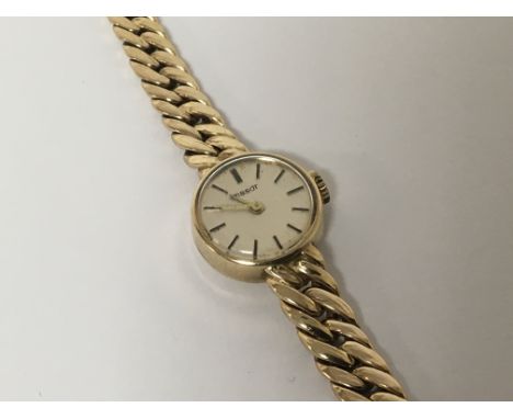 A ladies 9carat gold Tissot watch with conforming 9ct gold attached bracelet. Total weight 25.9g