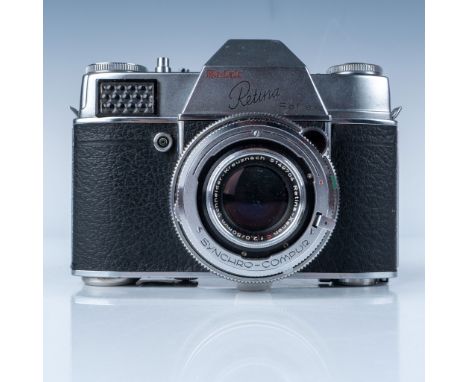 This lot features a vintage Kodak Retina Reflex camera, an iconic piece of photographic equipment manufactured by Kodak AG, t