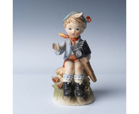 Goebel Hummel porcelain figurine titled Photographer, designed by Erich Stauffer and marked with the Goebel bee hallmark. The