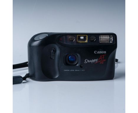Canon Snappy AF 35mm film camera featuring a built-in 35mm f/4.5 lens and autofocus functionality for easy and precise shooti