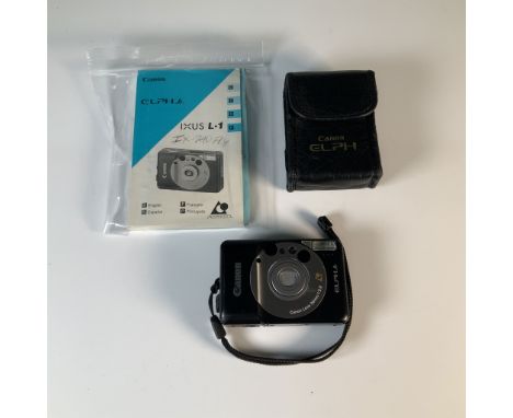 Compact Canon ELPH Jr. camera designed for Advanced Photo System (APS) film, featuring a Canon 26mm f/2.8 lens. Includes orig