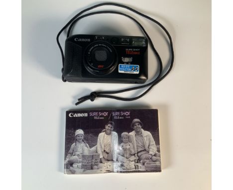 Canon Sure Shot Telemax compact 35mm film camera featuring a 38-70mm lens with autofocus and built-in flash. This camera incl