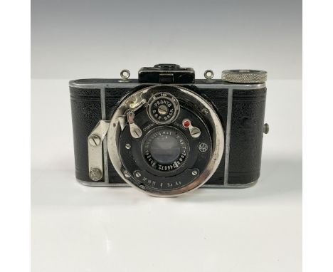 The Ihagee Vest Pocket Camera is a compact, folding camera designed for portability and ease of use. Manufactured by the Ihag