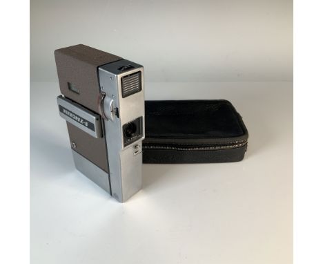 This vintage Nikkorex 8 8mm movie camera, manufactured in Japan, features a Nikkor f/1.8 10mm lens for crisp and bright video