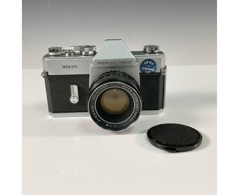 The Mamiya/Sekor 1000 DTL is a vintage 35mm single-lens reflex (SLR) camera, celebrated for its dual metering system and reli