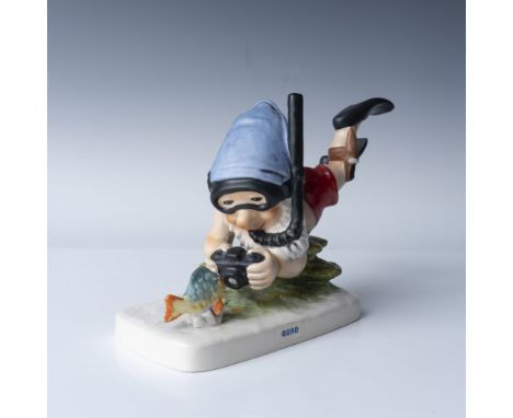 This Hummel Goebel figurine, titled "Gerd the Diver", depicts a whimsical underwater scene featuring a diver gnome in flipper