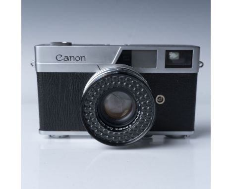 This is a Canonet rangefinder film camera, part of Canon's renowned mid-century lineup. It features a Canon SE 45mm f/1.9 len