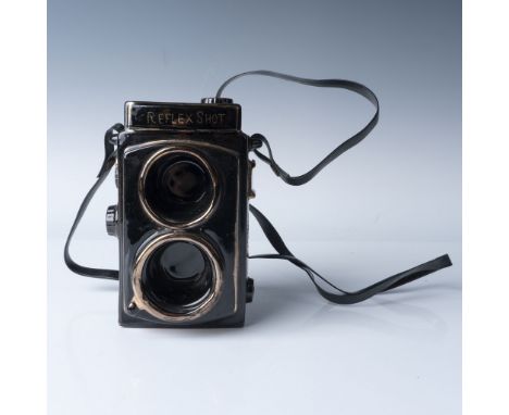 Charming ceramic figurine designed to resemble a vintage twin-lens reflex camera. Features a glossy black glaze with copper-t