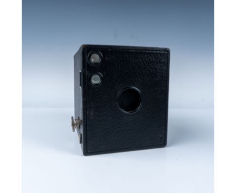 Classic Eastman Kodak vintage box camera, featuring a textured black exterior and a metal shutter mechanism. This camera, lik