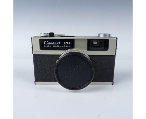 Vintage Canonet 28 rangefinder camera manufactured by Canon in the early 1970s. Features a Canon SEIKO-LA fixed lens with a 4