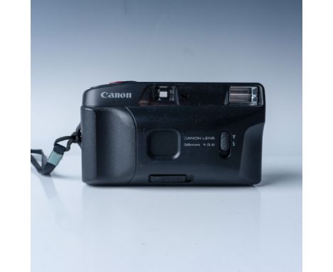 Vintage Canon Snappy EZ 35mm film camera featuring a fixed 35mm f/3.8 lens. Manufactured in Japan, this compact point-and-sho