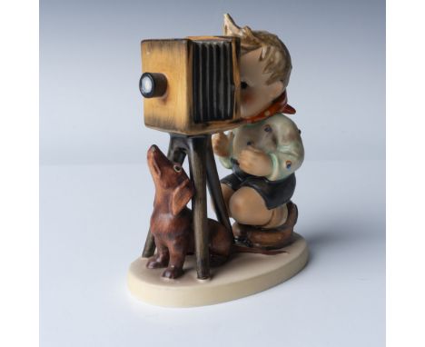 Hummel Goebel figurine 290, titled The Photographer, produced by Goebel in West Germany. This delightful piece features a boy
