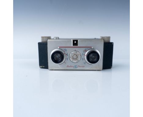 This vintage Delta Stereo camera, designed for stereoscopic photography, features dual lenses for creating three-dimensional 