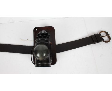 Policemans Bullseye Lamp by the maker Wyncott &amp; Son, Birmingham, dated 1917, fitted to a heavy belt with leather heat/oil