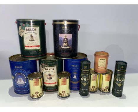 Five Bell's Old Scotch Whisky decanters, with tins and six others