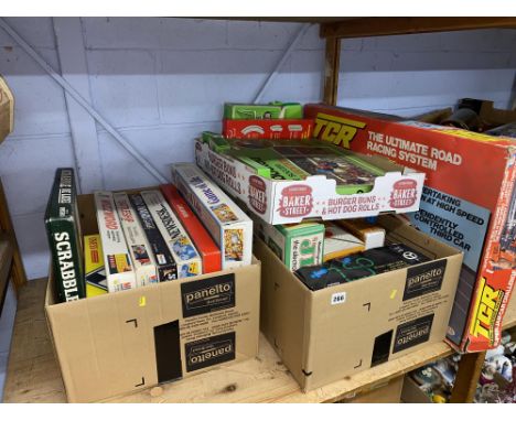 Shelf of vintage games to include Subbuteo, TCR Racing etc