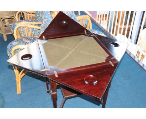 An Edwardian mahogany envelope card table