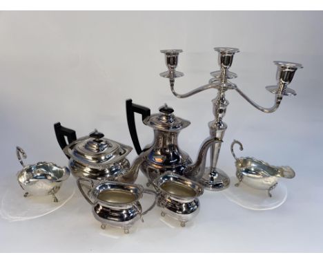 A selection of silver plated ware to comprise candelabra, tea pot, hot water jug, cream jug, sucrier and two sauce boats