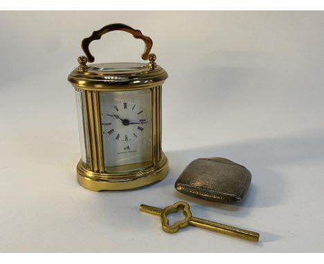 A Matthew Norman of London carriage clock, housed in a brass and glass four sided case, 9cm H and a silver engraved Asprey of