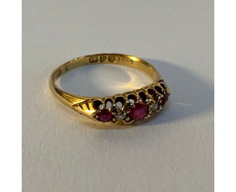 An 18ct gold diamond and ruby ring, weight 3.3g