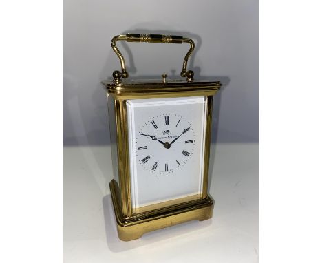 A Matthew Norman of London carriage clock, with brass four sided glass case enclosing an enamelled Roman dial and Swiss movem