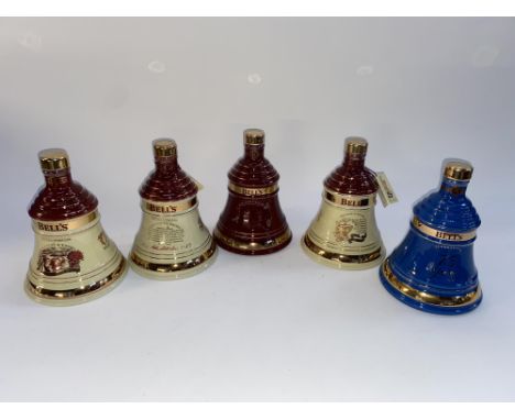 Five boxed Bell's Old Scotch Whisky decanters commemorating the years 1996, 1997, 1999 and 2001