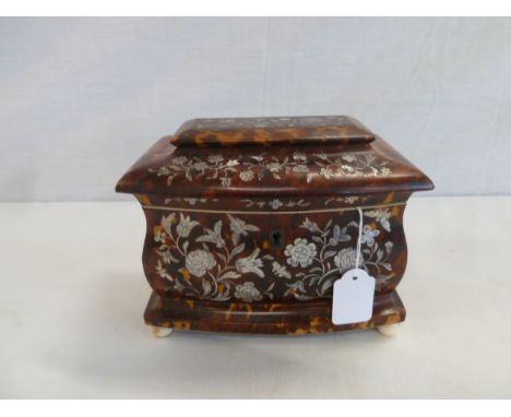 George IV tortoiseshell tea caddy of bombe form, inlaid with mother of pearl butterflies and flowers, with ivory stringing an