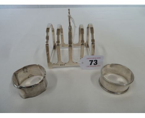 Silver toast rack- London 1923, silver napkin rings (3)