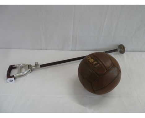 Vintage leather lace-up football and shooting stick 