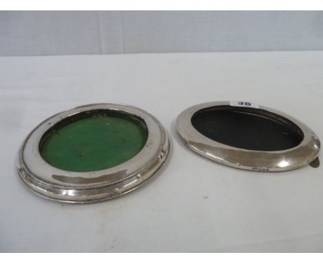 Oval and round silver picture frames (2)