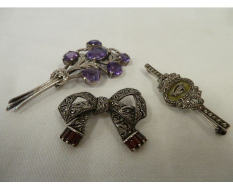 Silver and amethyst posy brooch and marcasite brooches (3)