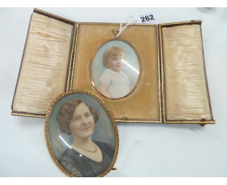 Portrait miniature of child in gold oval frame suspended in velvet lined tooled leather case and portrait miniature of lady i