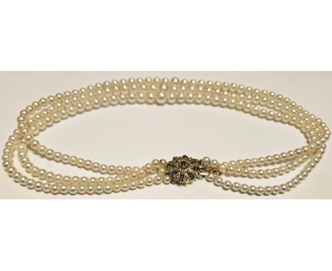 Pretty vintage triple strand of pearls, on 9ct gold clasp mounted with 9 blue sapphire coloured stones
reasonable used condit