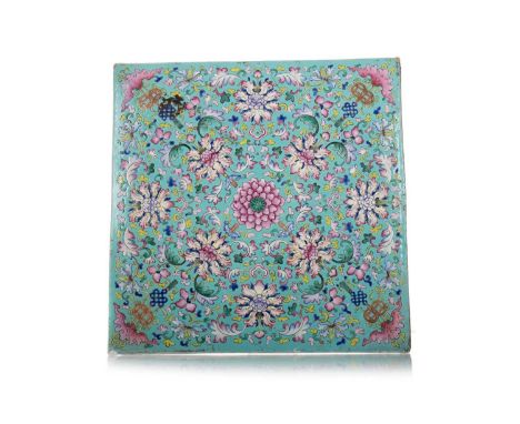 CHINESE POLYCHROME NYONYA STRAITS STYLE TILE LATE 19TH/EARLY 20TH CENTURY decorated with flowers and scrolls, on a turquoise 