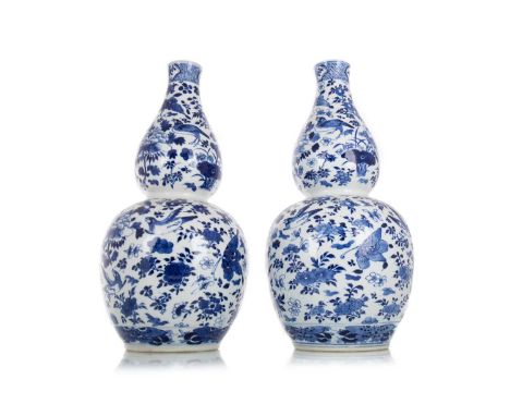 PAIR OF CHINESE BLUE AND WHITE DOUBLE GOURD VASES LATE 19TH CENTURY decorated with birds, butterflies and floral sprays, bear