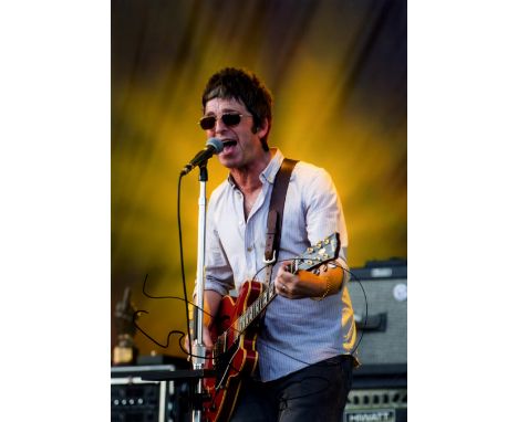 OASIS: Noel Gallagher (1967-     ) English Musician. Signed colour 8 x 12 photograph of Gallagher standing in a three quarter