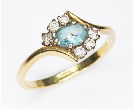 A diamond and aquamarine cluster ring, hallmarked band (purity mark rubbed), gross wt. 3.1g, size R. 