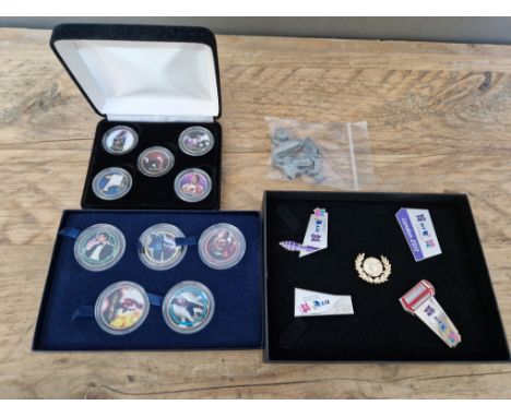 Two sets of Michael Jackson commemorative coins, a London 2012 olympic badge set and a bag of vintage monopoly counters. 