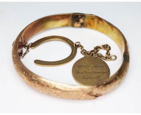 A hallmarked 9ct gold bangle and horseshoe, together with a fob marked '9.375', wt. 16.9g, as found.  