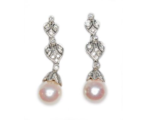 A pair of South Sea cultured pearl and diamond drop earrings, the peals approx. 8mm in diameter, length 30mm, both marked '18