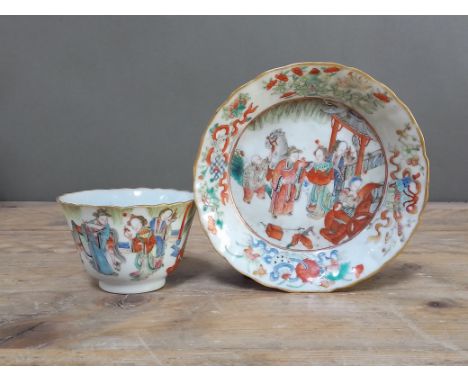 A Chinese porcelain wine cup and saucer, decorated in over enamels with figures, 19th century, Xianfeng 1851-1861, seal to ba